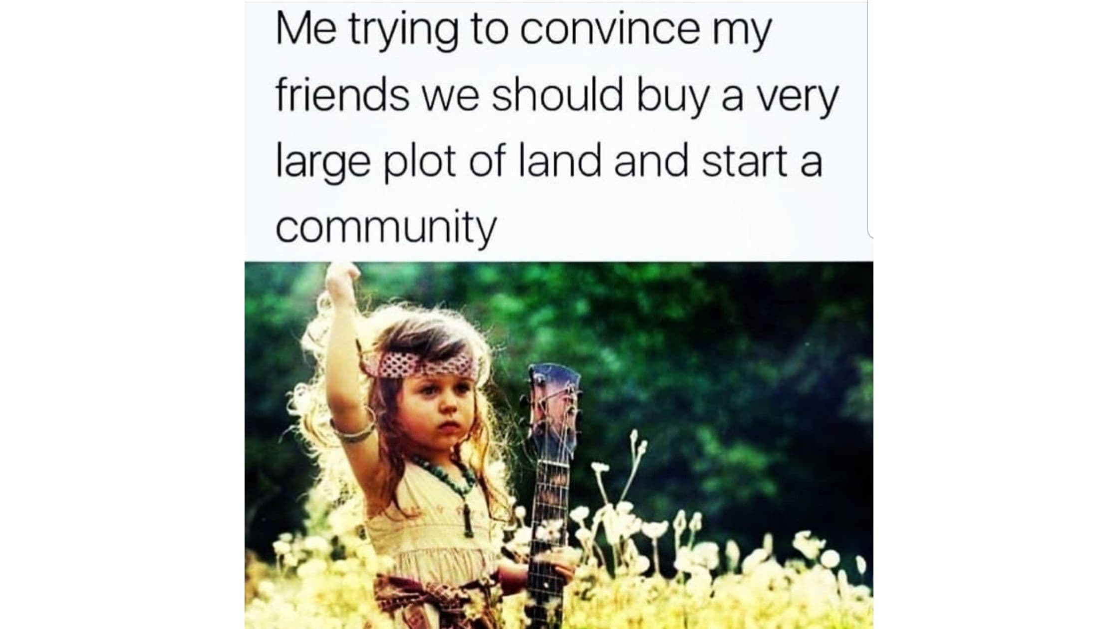 Young toddler with a guitar and bohemian dress