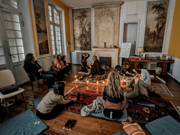 Group sitting on floor at Life Itself Residency